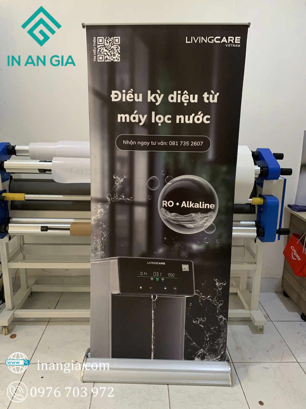 Standee quảng cáo máy lọc nước Livingcare RO Alkaline đang chảy nước trong phòng in